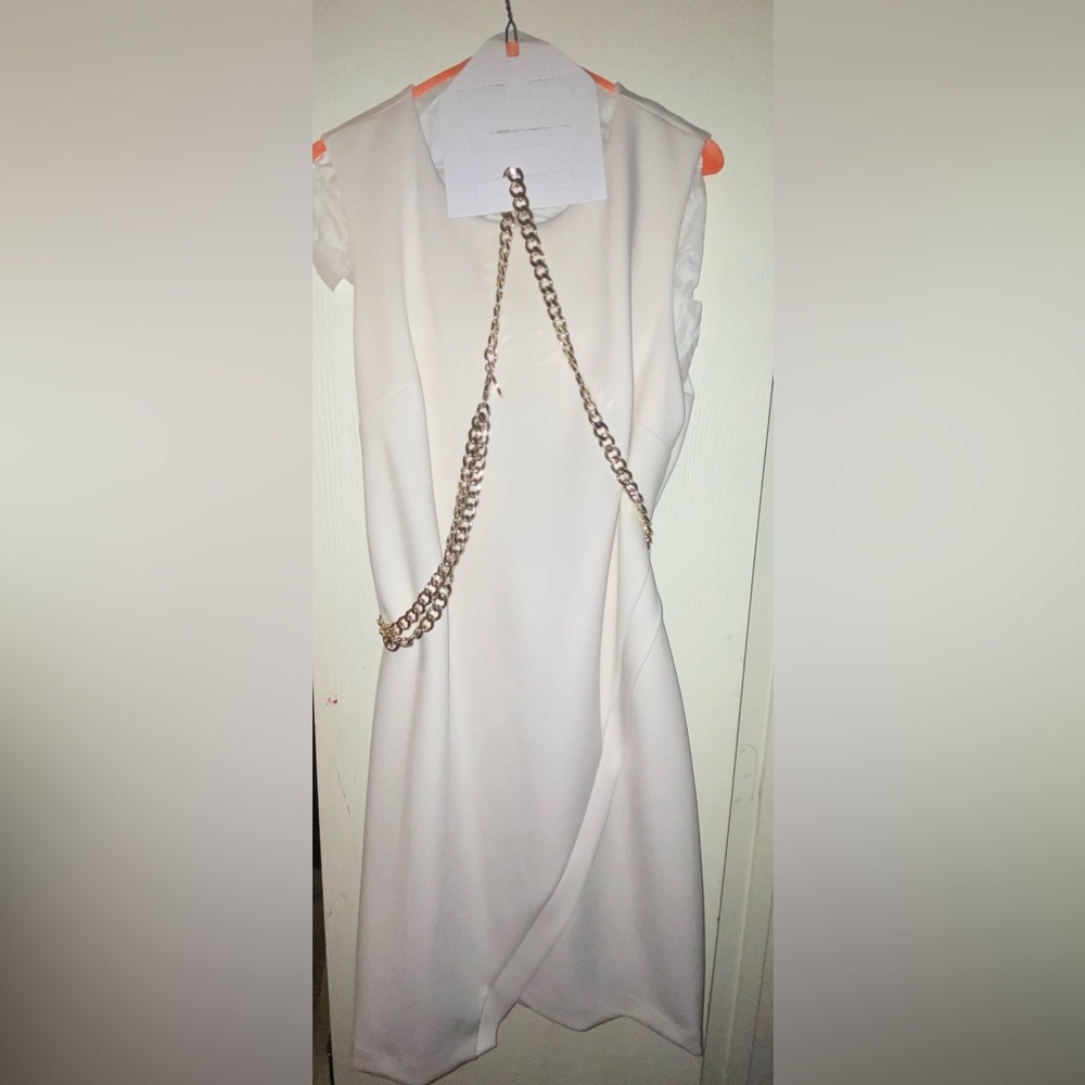 Tommy Hilfiger all white with golden chain wrapped around dress